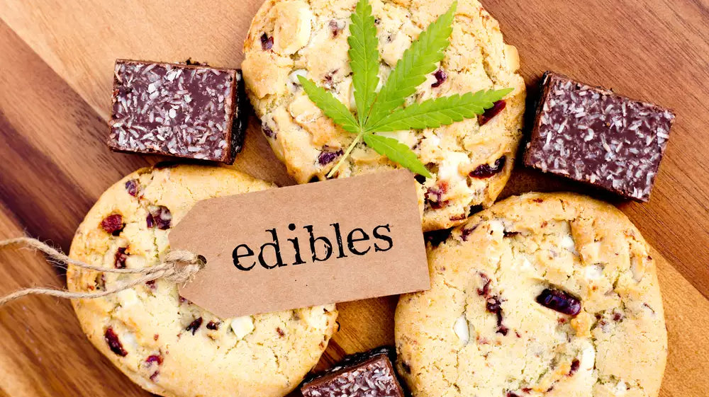 Do edibles expire? Assorted hemp-derived THC edibles like cookies and chocolate shown on a wooden board