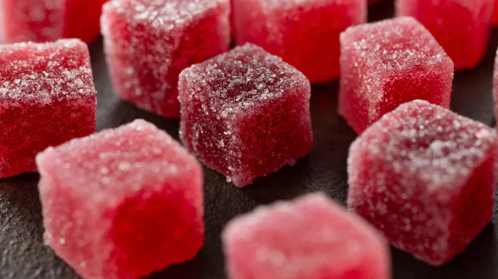 Close-up of a red delta-9 THC gummy.