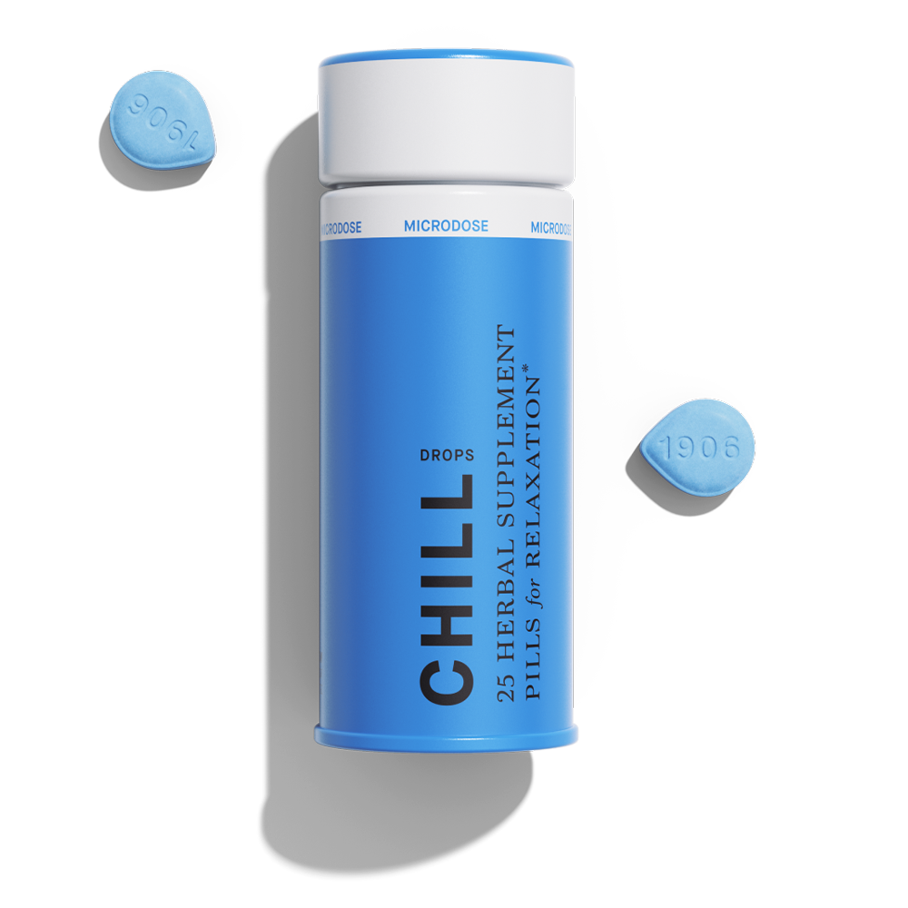 Blue container of 1906 Chill herbal supplement pills for relaxation, with two blue microdose pills beside it.