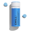 Blue container of 1906 Chill herbal supplement pills for relaxation, with two blue microdose pills beside it.