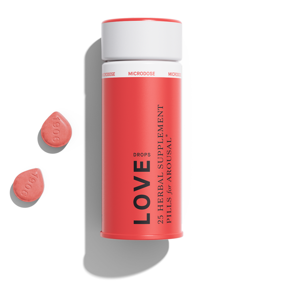 1906 Love herbal supplement pills for arousal in a red container with two pink pills beside it.