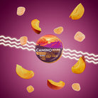 Colorful Camino Sours peach-flavored hemp gummies with CBD and THC, surrounded by peach slices and gummies on a purple bac...