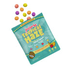 Joy Bombs Tropical Haze THC hemp chews package featuring colorful fruit-flavored candies in a vibrant design.