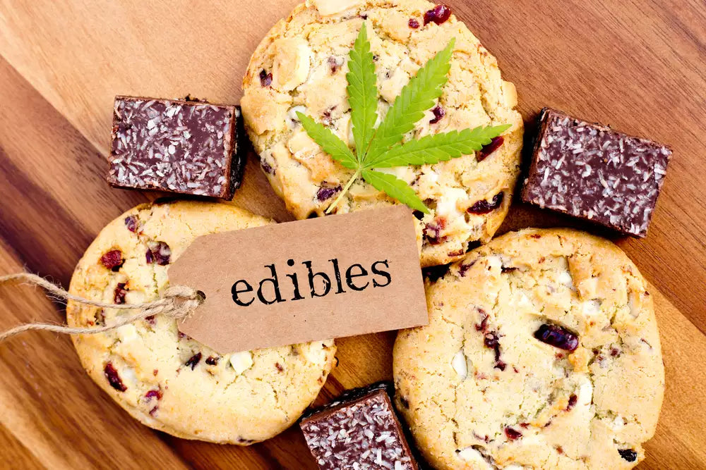 Do edibles expire? Assorted hemp-derived THC edibles like cookies and chocolate shown on a wooden board
