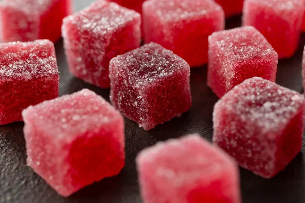 Close-up of a red delta-9 THC gummy.